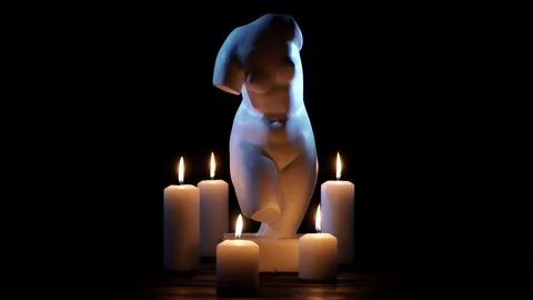 Bust of Venus and burning candles on a black background 動画素材 101419225