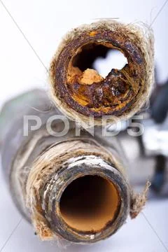 Busted rusty pipes Stock Photos