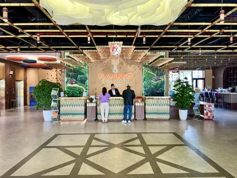 Bustling atmosphere at the check-in counter inside Flamingo Heritage Onsen Re Stock Photos