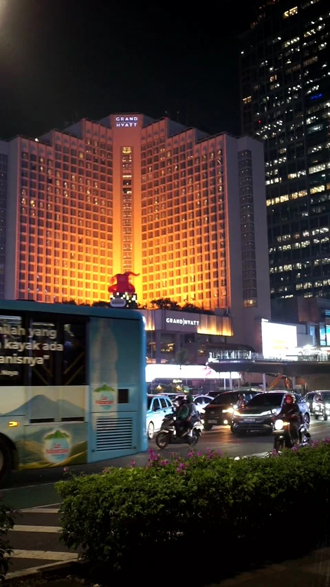 The bustling atmosphere of night traffic on a main avenue in Jakarta Stock Footage 339912782