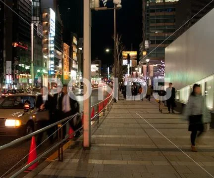 Bustling busy night scene in Tokyo Japan Stock Photos