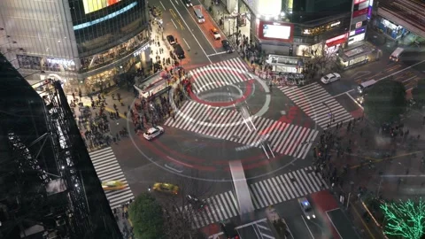 Bustling City Intersection at Night with Vibrant Traffic Lights Stock Footage 315975224