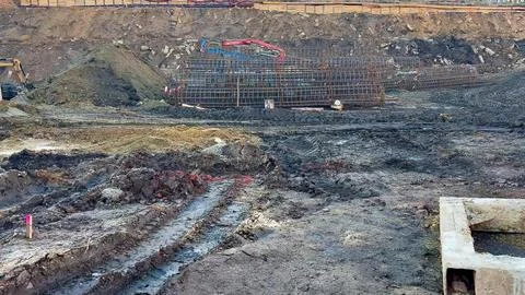 A bustling Construction Site that features ongoing Excavation and laying of.. Foto stock