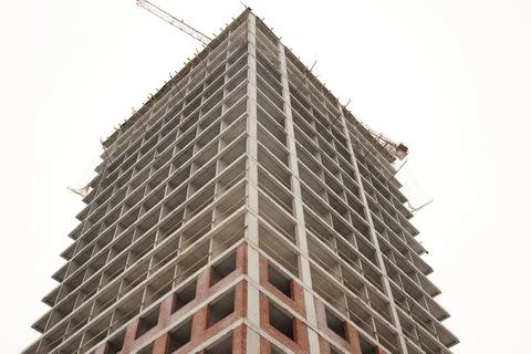 A bustling Construction Site showcasing Cranes, Building Framework, and full Fotos de archivo