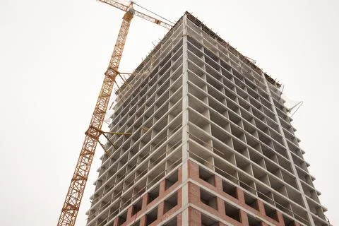 A bustling Construction Site showcasing Cranes, Building Framework, and full Fotos de archivo