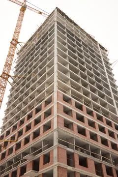 A bustling Construction Site showcasing Cranes, Building Framework, and full Fotos de archivo