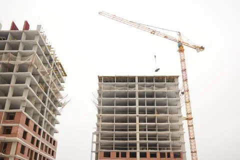 A bustling Construction Site showcasing Cranes, Building Framework, and full Fotos de archivo