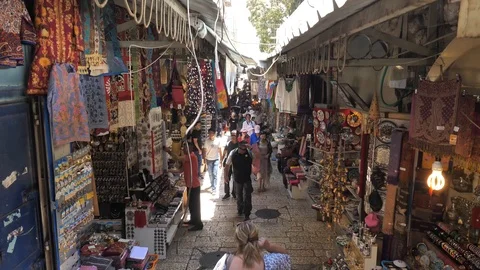 Bustling crowd on old market in Jerusalem, Israel. Tilt down shot Stock Footage
