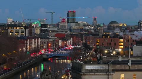 Bustling Evening Traffic and Illuminated Bridge in Dublin Stock Footage 332444548