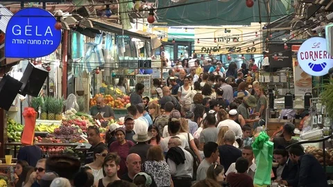 Bustling grocery market, crowds shopping for Shabbat in Jerusalem, Israel Stock Footage