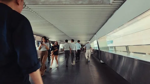 A bustling indoor transit system in Hong Kong, featuring people moving Stock Footage 338311426