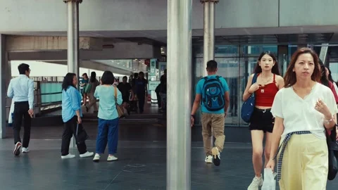 A bustling modern transit hub with high-tech architecture, characterized by Video stock 338311466