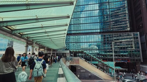 A bustling modern transit hub in Hong Kong with sleek contemporary architecture Stock Footage 338311463