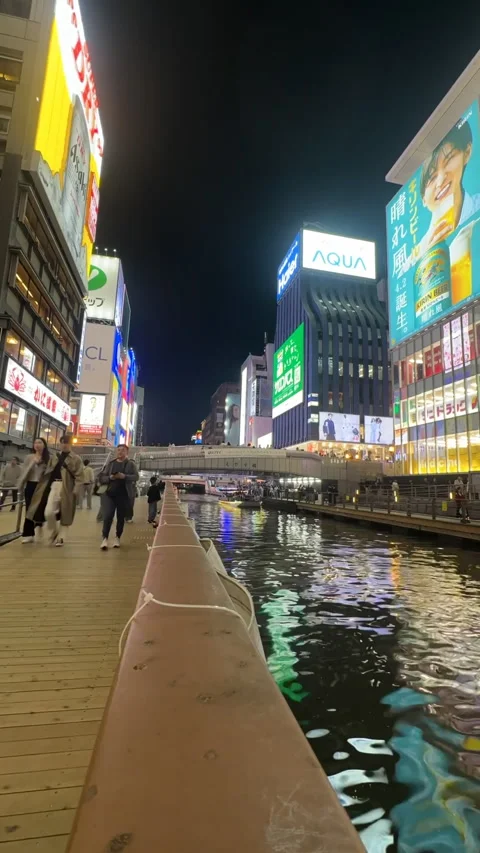 A bustling night time lapse footage by the canal in Osaka, Japan 스톡 동영상 316174801