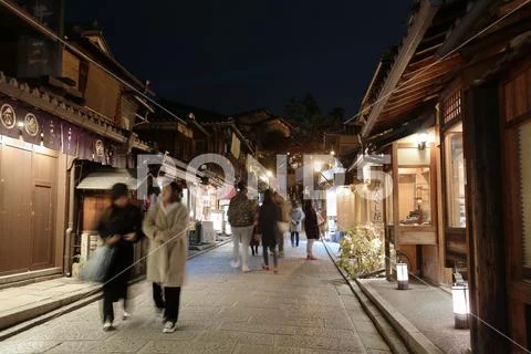 Bustling pedestrian street on a hill lined Stock Photos