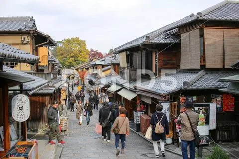 Bustling pedestrian street on a hill lined Stock Photos