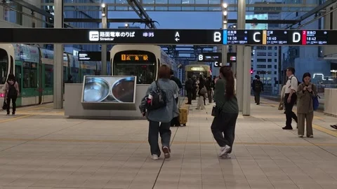 The bustling platform of Hiroden Hiroshima Station Video stock 338313269