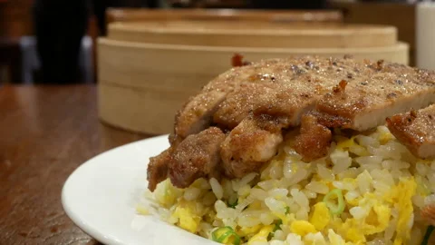A bustling scene of crispy fried pork and rice in a famous Chinese restaurant Video stock 236635231