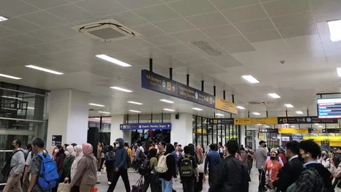 A bustling scene at Indonesian train station. Stock Footage 320451180