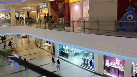 A bustling shopping mall interior featuring multiple floors Stock Footage 304188965