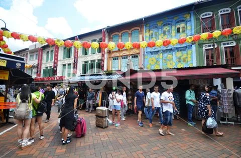Bustling street of Chinatown district in Singapore Stock Photos