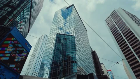 A bustling urban environment from below, featuring iconic glass and steel Stock Footage 338311517