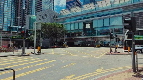 A bustling urban intersection in Hong Kong with modern architecture and vibrant Video stock 338311423