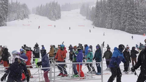 Bustling Winter Resort: Skiers Queue for Lift, BC, Canada, Jan 2023 Stock Footage 253121201