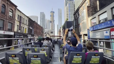 Bustling yonge street from sightseeing bus, toronto, canada Stock Footage 302572094