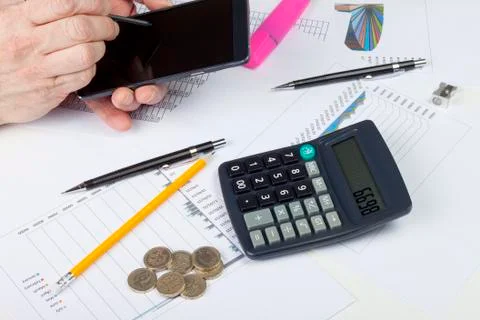Busy accountant at work using his smart phone Foto stock