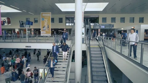 Busy airport interior with escalators  Stock Footage 112712514