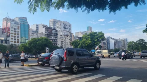 Busy Avenida 9 de Julio intersection in Buenos Aires, Argentina. Iconic urban Stock Footage 341695205