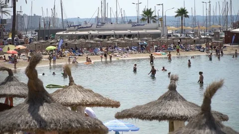 Busy beach tourists Stock Footage 128348205