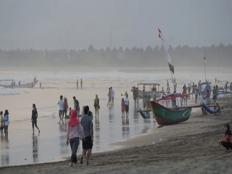 Busy beach with tourists in Pangandaran Java Indonesia Stock Footage 84048501