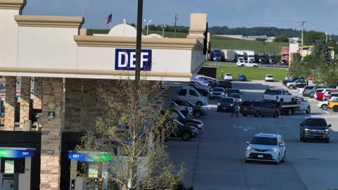 Busy Buc-ee’s gas station in America with multiple fuel pumps, parked cars and Stock Footage 316045886