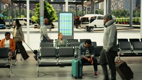Busy bus stop terminal with people preparing for international coach travel Stock Footage 334722009