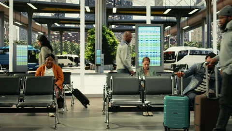 Busy bus stop terminal with people preparing for international coach travel Stock Footage 334722327