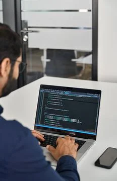 Busy businessman software developer working on computer in office. Over sho.. Stockfoto's