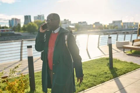Busy businessman walking along the street Stock Photos