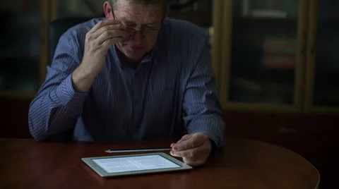 Busy businessman working with laptop documents, smartphone and tablet Stock-Footage 31801692