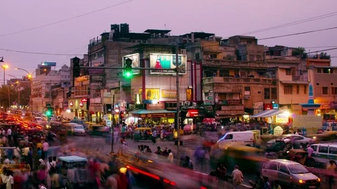 Busy car traffic in the city center of Delhi, India. Time-lapse at sunset Stock Footage