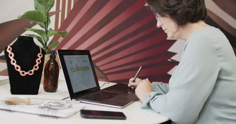 Busy caucasian female worker using laptop in jewellery shop in slow motion Stock Footage 341466888