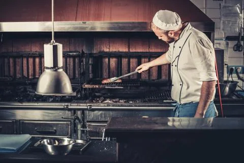Busy chef at work in the restaurant kitchen Foto stock
