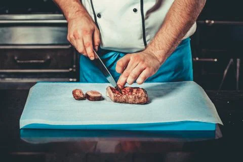 Busy chef at work in the restaurant kitchen Fotos Stock