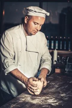 Busy chef at work in the restaurant kitchen Fotos Stock