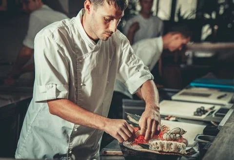 Busy chef at work in the restaurant kitchen 库存照片