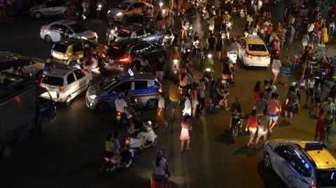 Busy city centre traffic intersection night lights crowd cars people chaos 4k Video stock 57223245