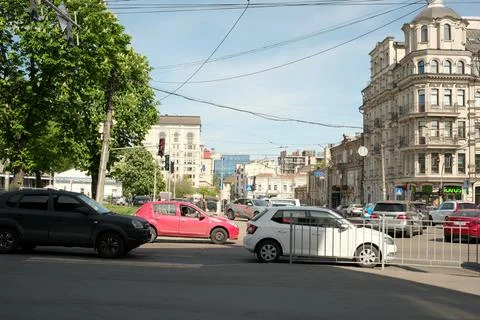 Busy city intersection captured on a bright sunny day in spring Stock Photos