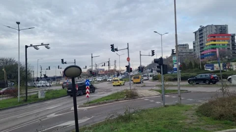 Busy city intersection traffic after rain in Varna Bulgaria November 28 2025 Stock Footage 322193081
