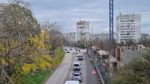 Busy city intersection traffic after rain in Varna Bulgaria November 28 2025 Stock Footage 322193130